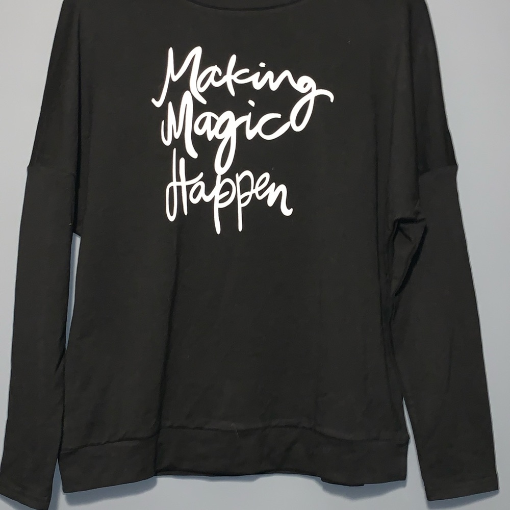 “Make Magic Happen” in cursive black crewneck